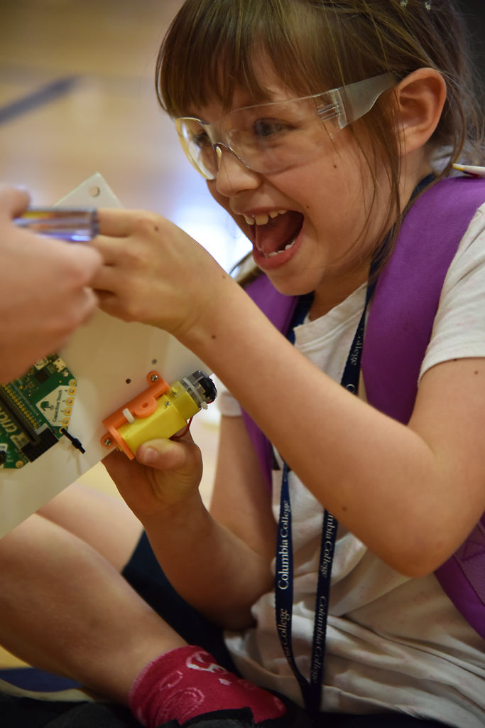 Cecilia Shull, 8, gets excited about building her car sculpture